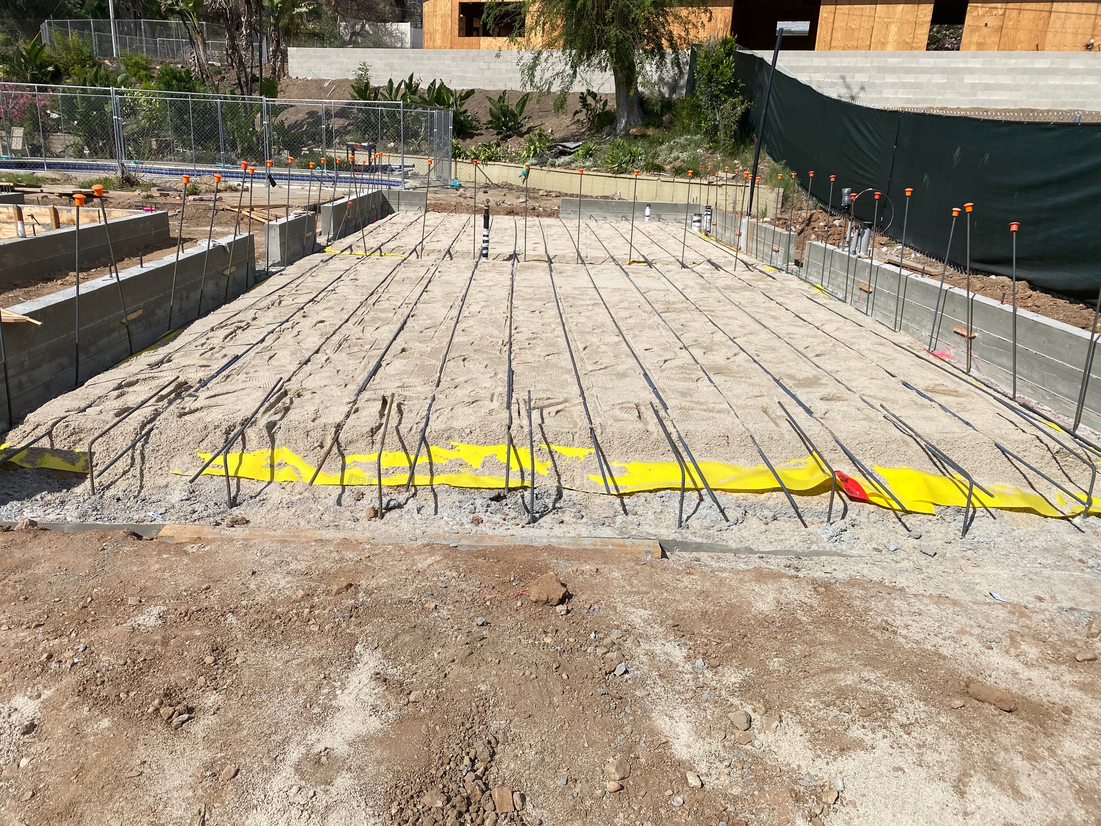 Rebar reinforcement laid inside concrete stem walls for structural concrete foundation construction on an Altadena rebuild — Concrete Etc., Inc., Los Angeles County, CA