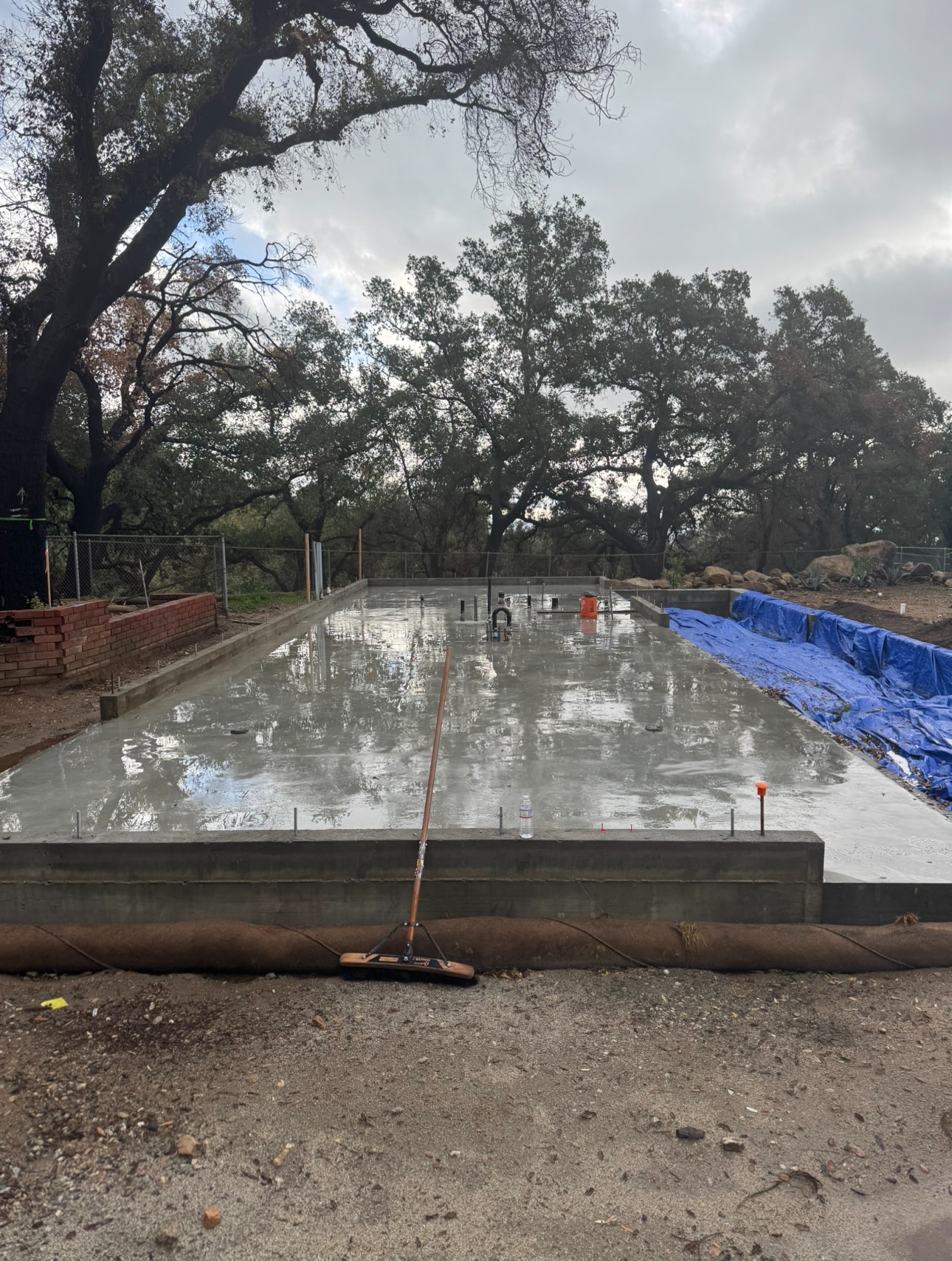 Concrete foundation slab curing — Altadena, CA
