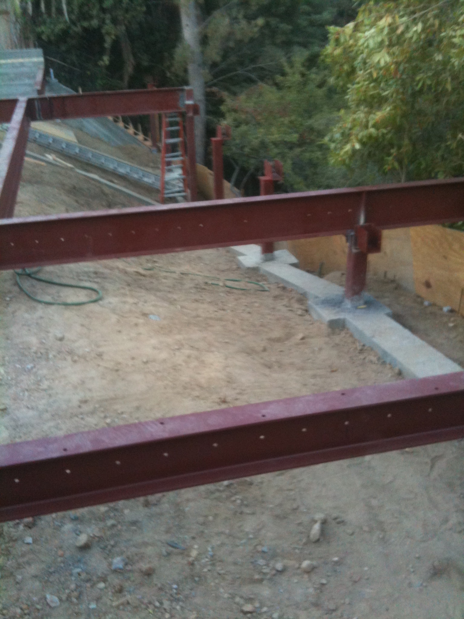 Grade beam and steel frame foundation construction on hillside lot in Los Angeles County by Concrete Etc., Inc.