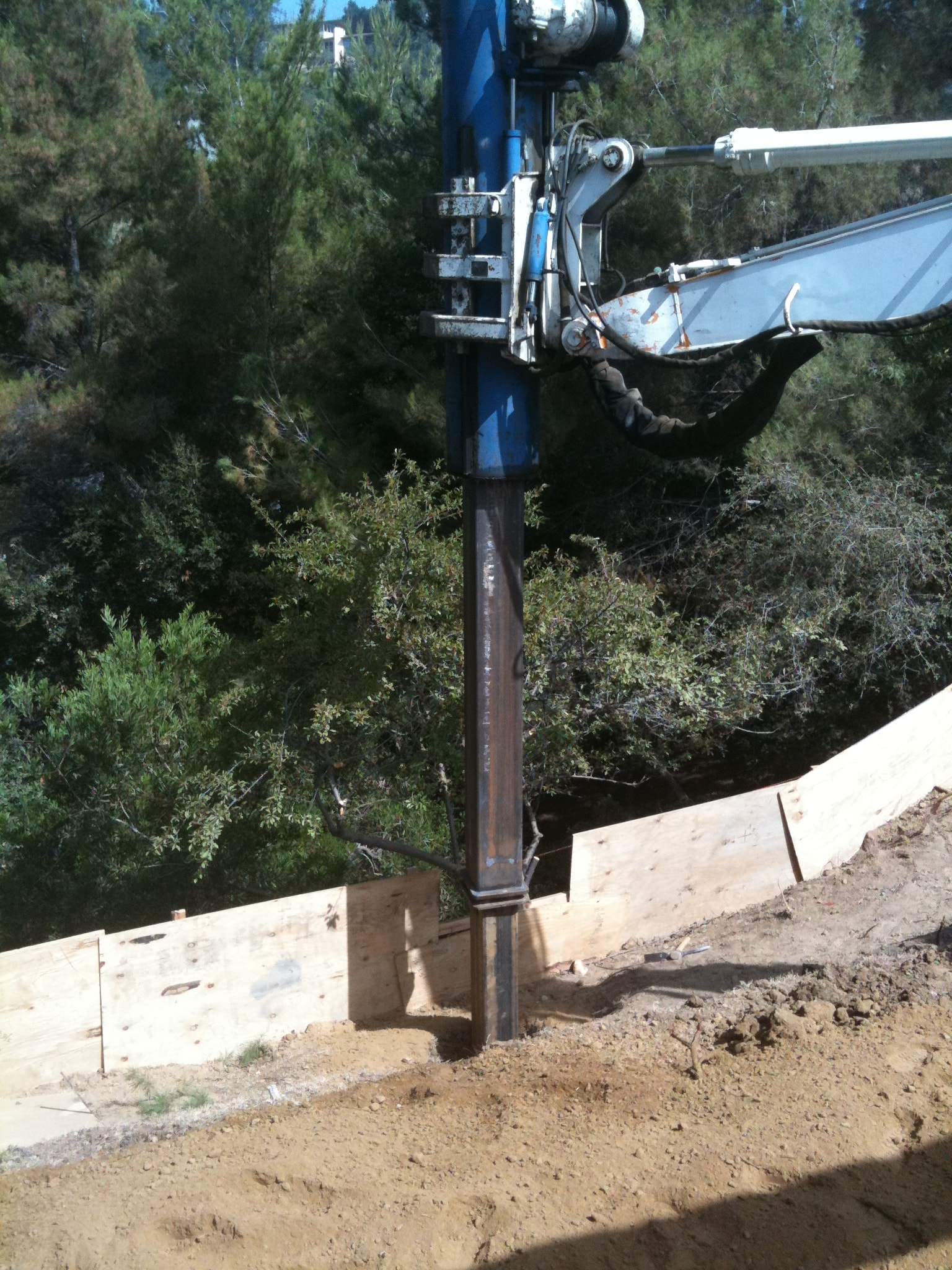 Caisson drill rig on hillside foundation construction site in Los Angeles County — Concrete Etc., Inc.