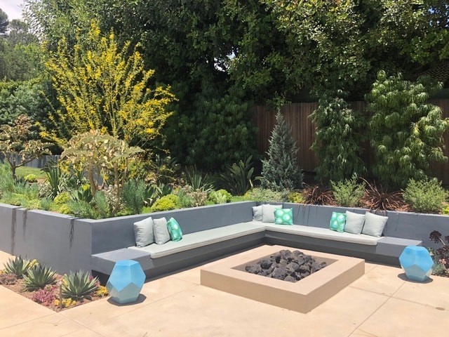CMU masonry retaining wall with poured-in-place concrete benches and fire pit in Beverly Hills — Concrete Etc., Inc.