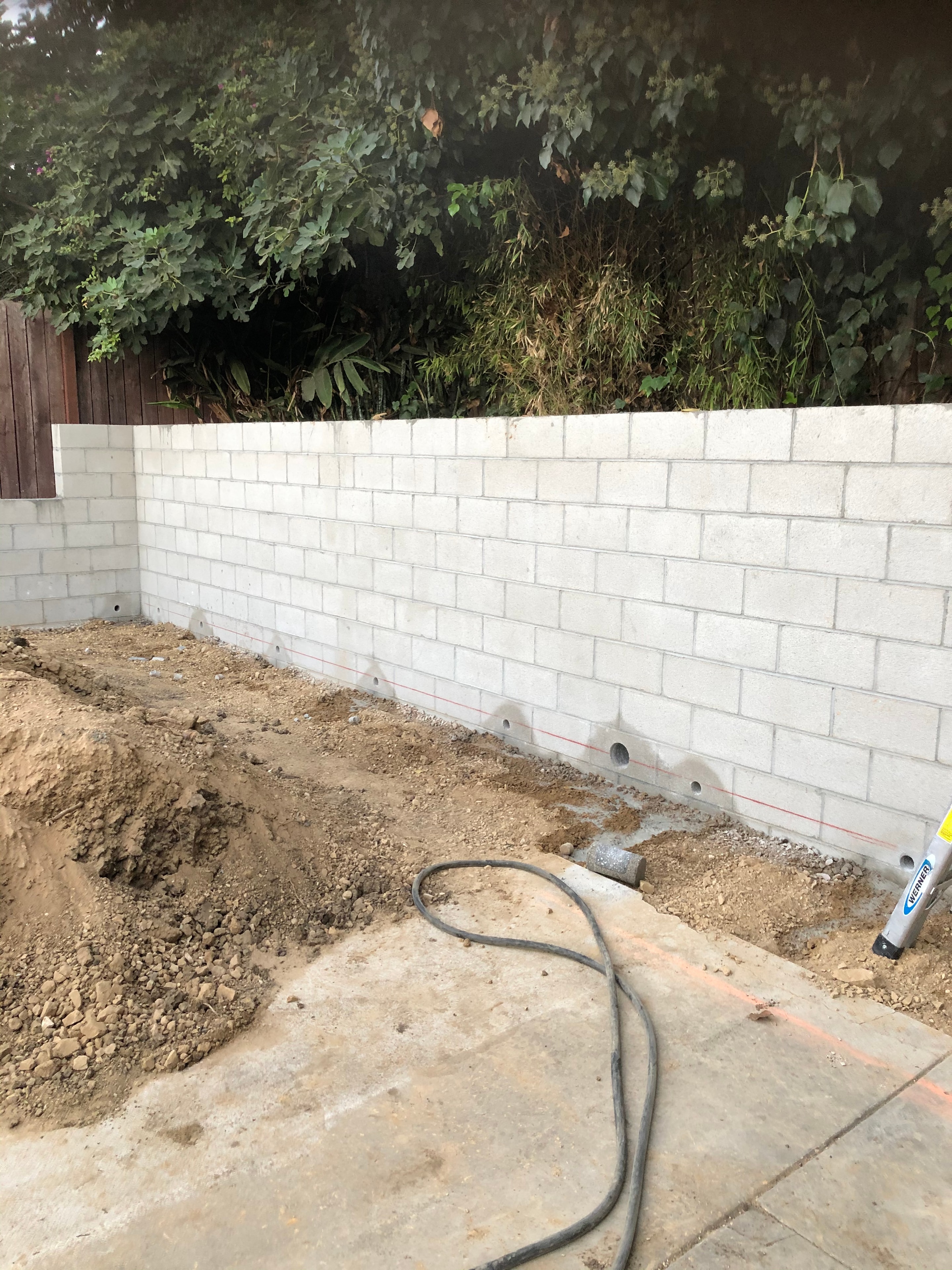 CMU masonry retaining wall under construction in Los Angeles — Concrete Etc., Inc.