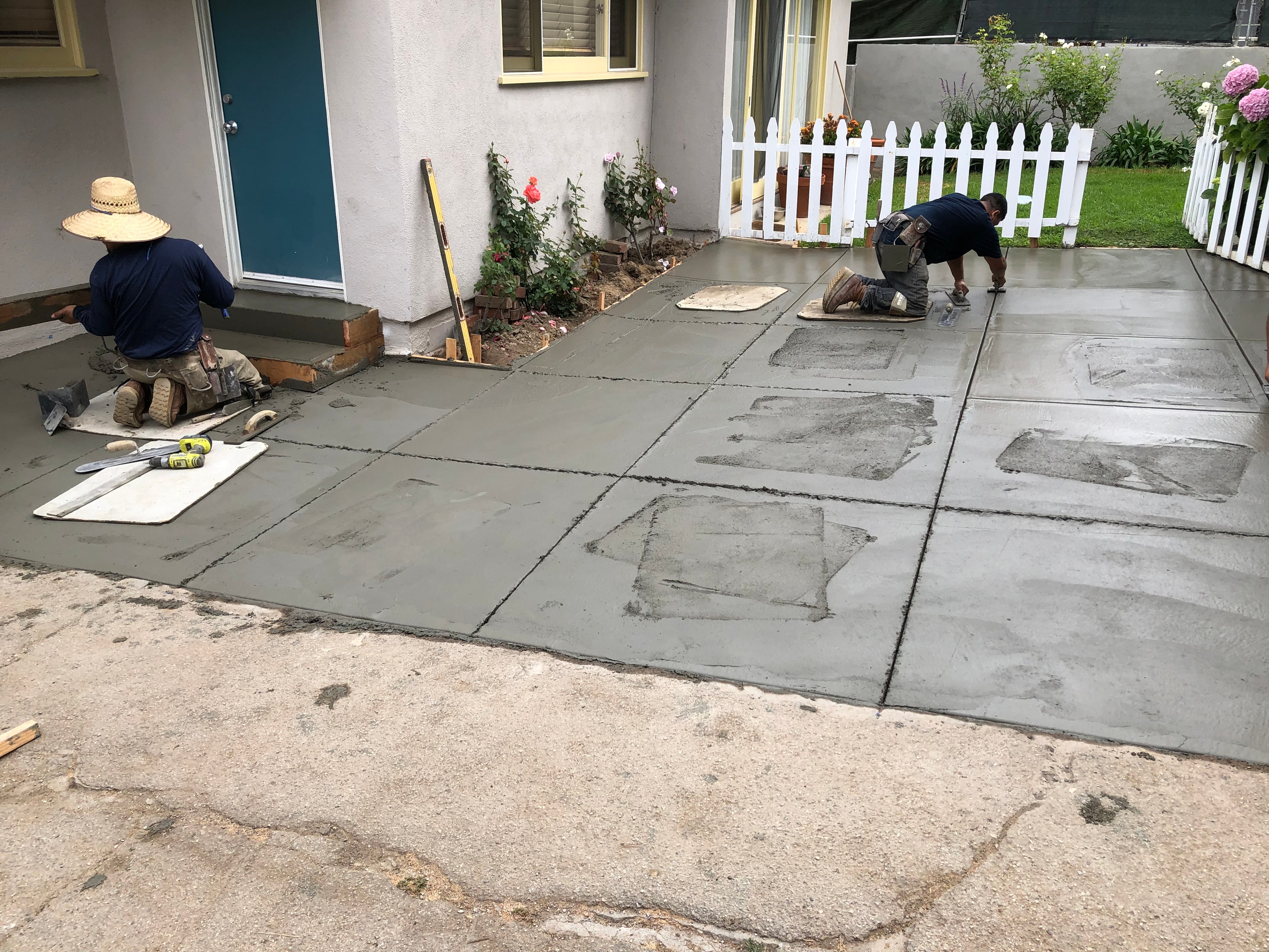 Concrete Etc. crew finishing a broom finish driveway at a Santa Monica residential property — Concrete Etc., Inc.