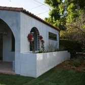 Completed ADU with stucco exterior and arched window, Los Angeles County