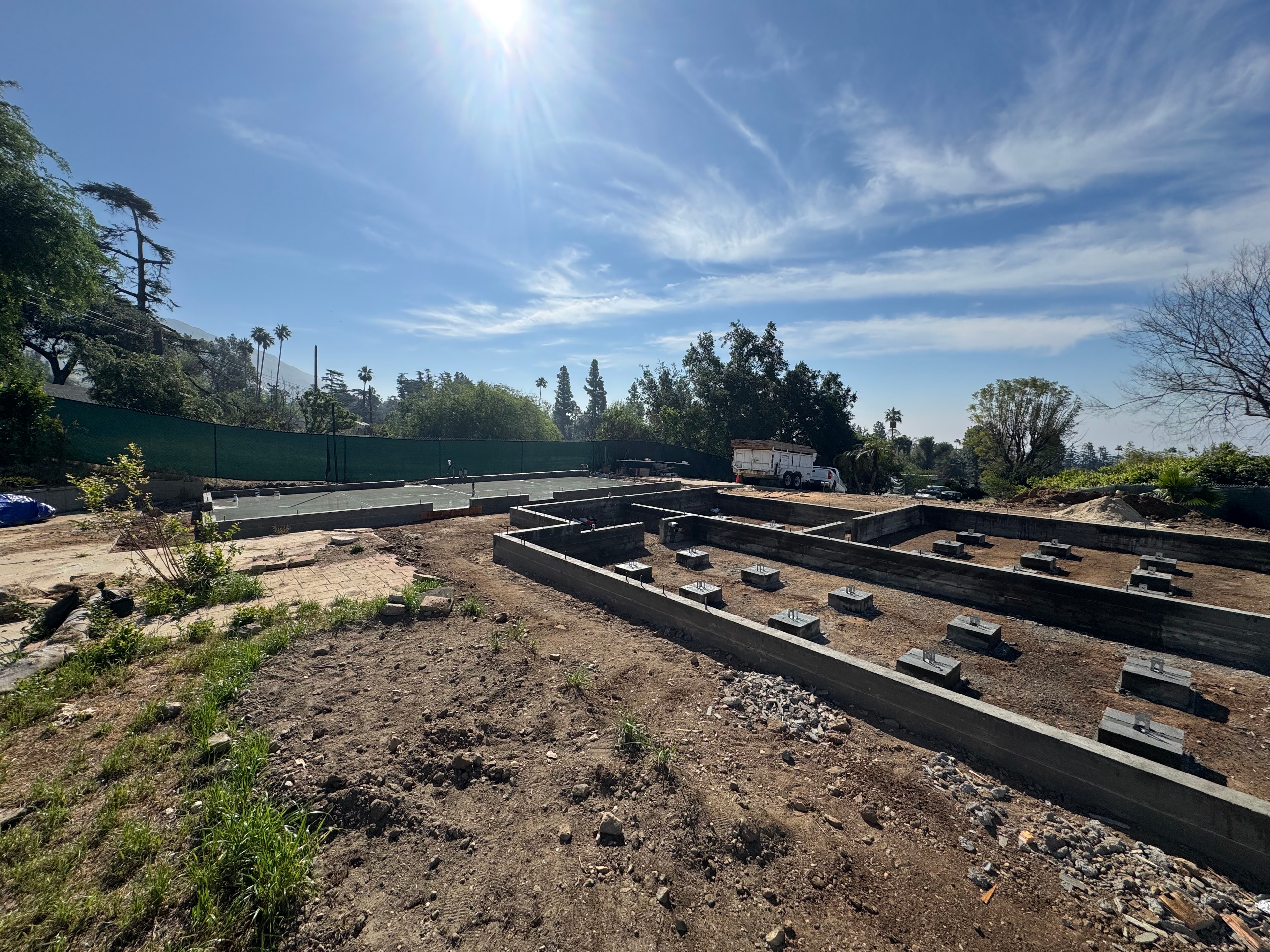 Completed concrete stemwall foundation with concrete footings and pad footings for new residential construction in Altadena, CA by Concrete Etc., Inc.