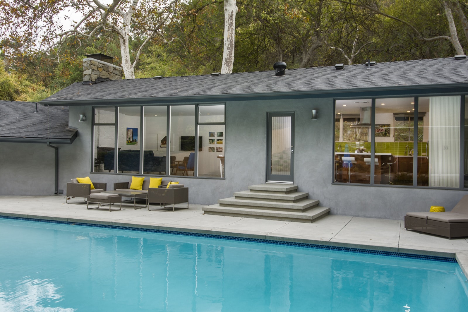 Sand finish concrete pool deck with coping and steps installed in Pasadena, CA by Concrete Etc., Inc.