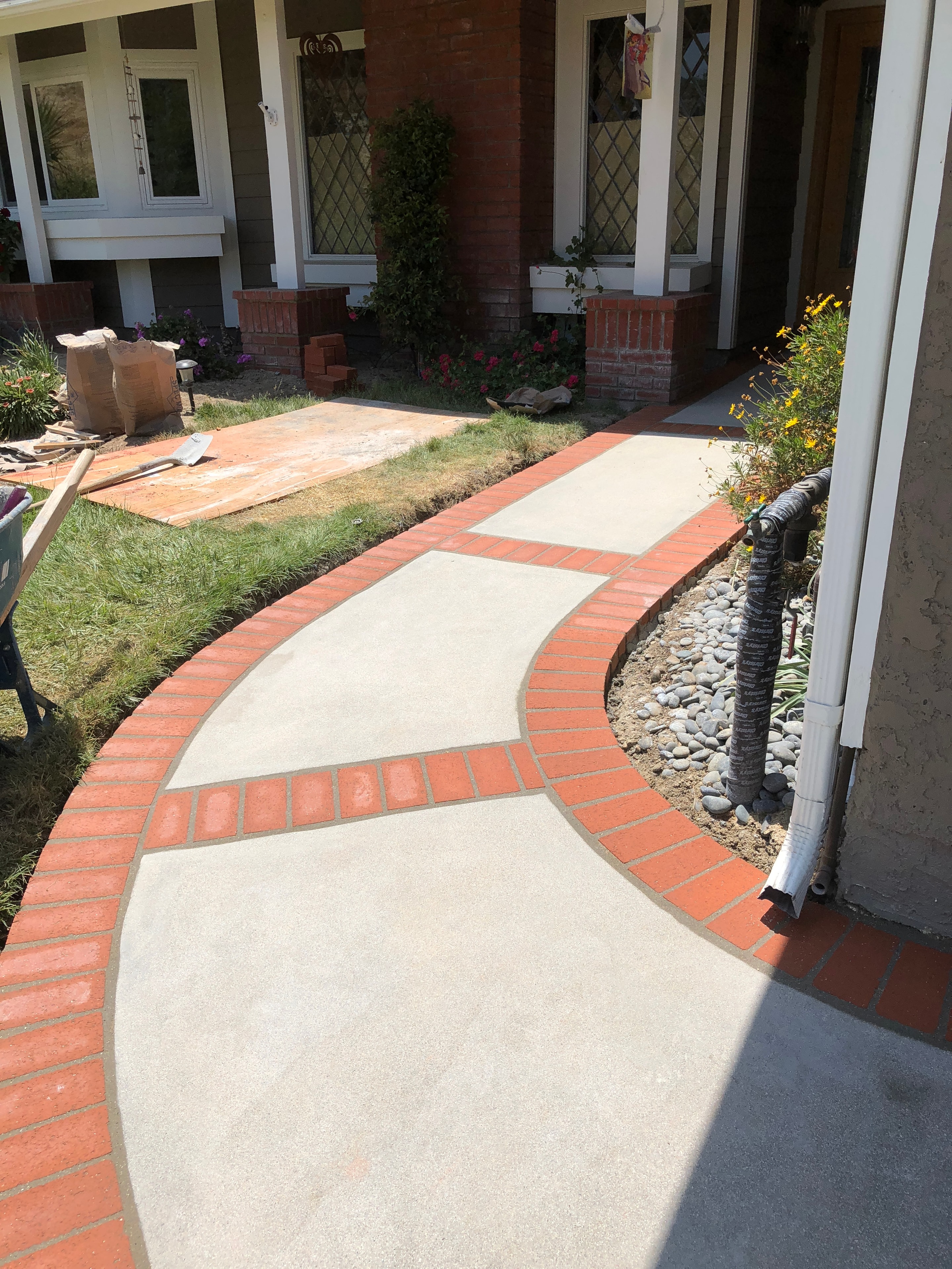 New concrete walkway with brick border and ribbons — Santa Clarita, CA