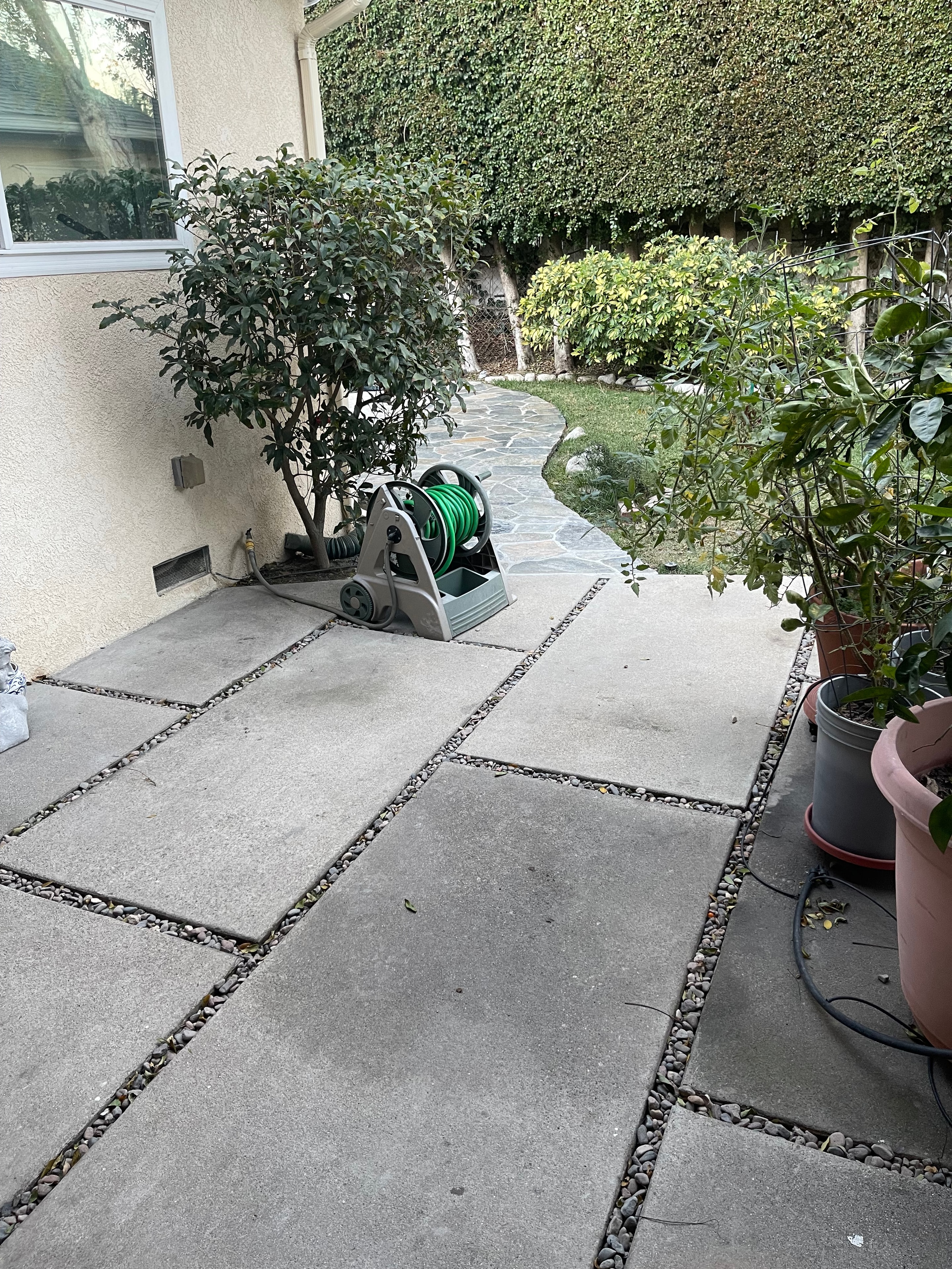 Concrete patio with gravel strips and flagstone, Sherman Oaks