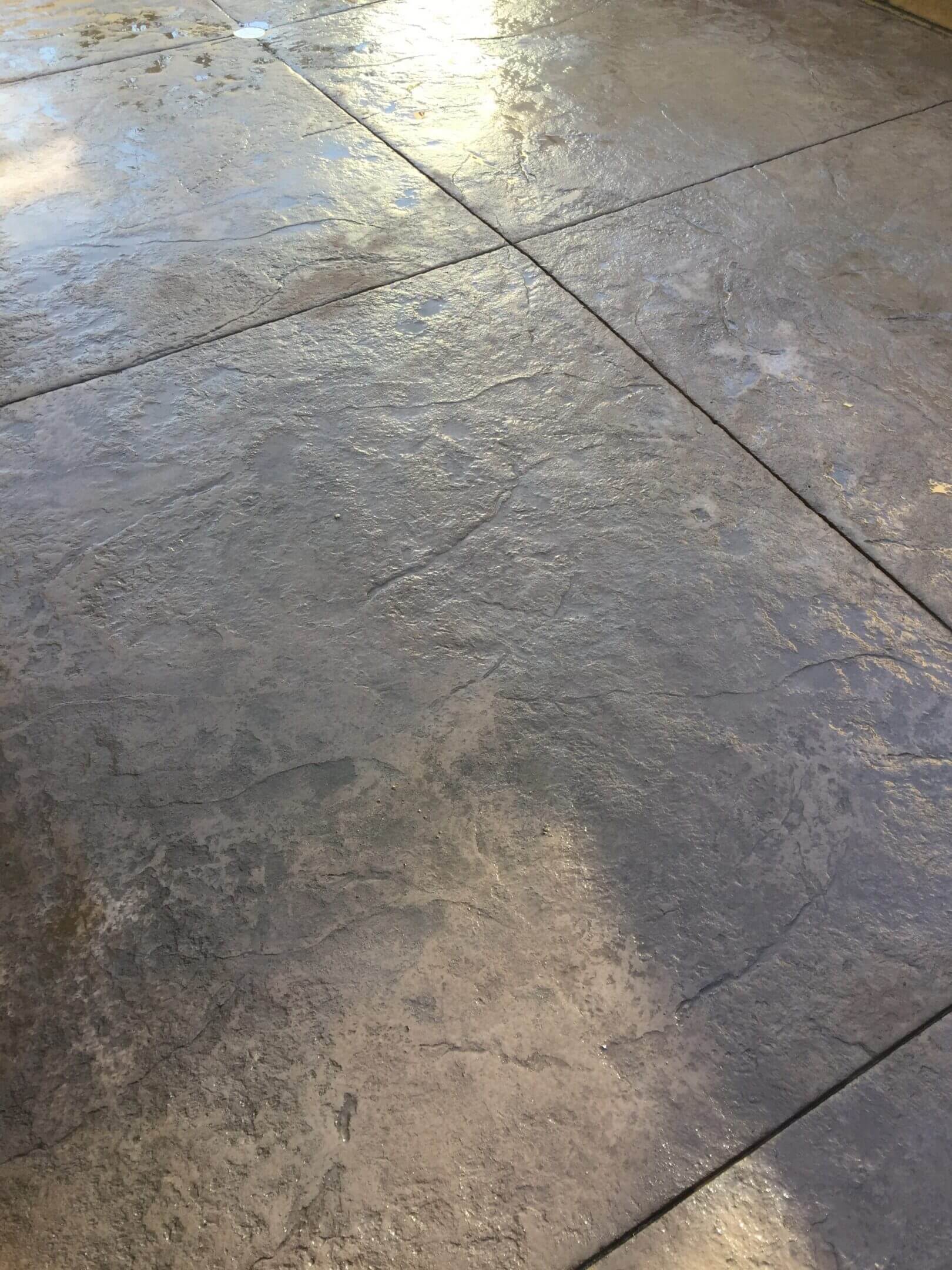 Stamped concrete patio with decorative pattern and finish installed in San Fernando Valley, CA by Concrete Etc., Inc.