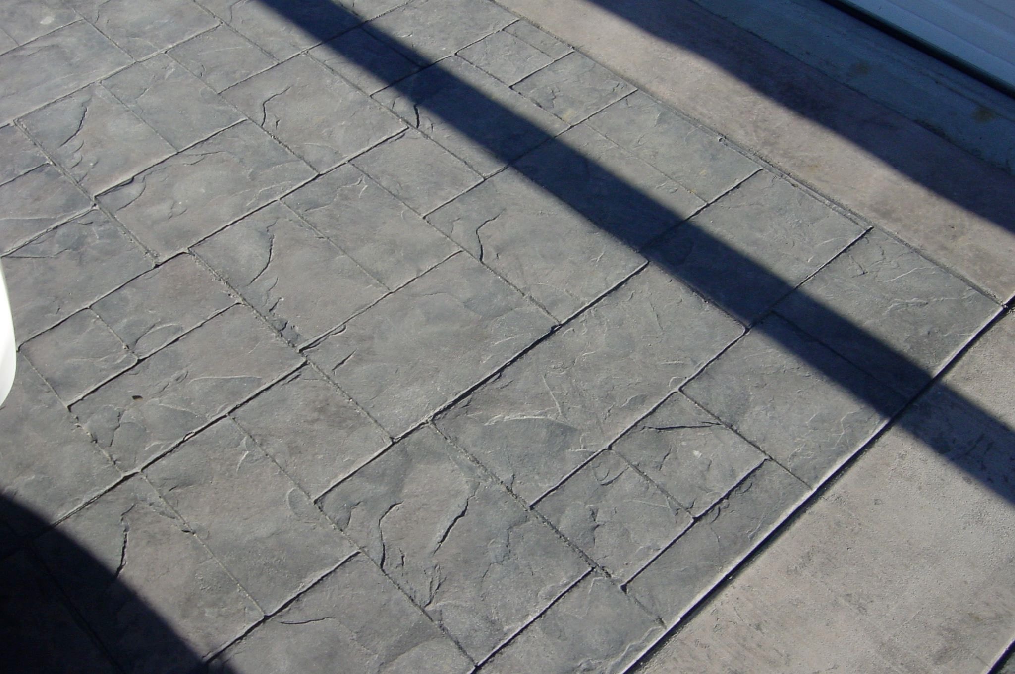 Herringbone stamped concrete pattern close-up by Concrete Etc.